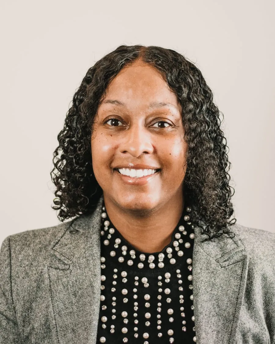 Ruth Abernathy, founder, in a grey blazer